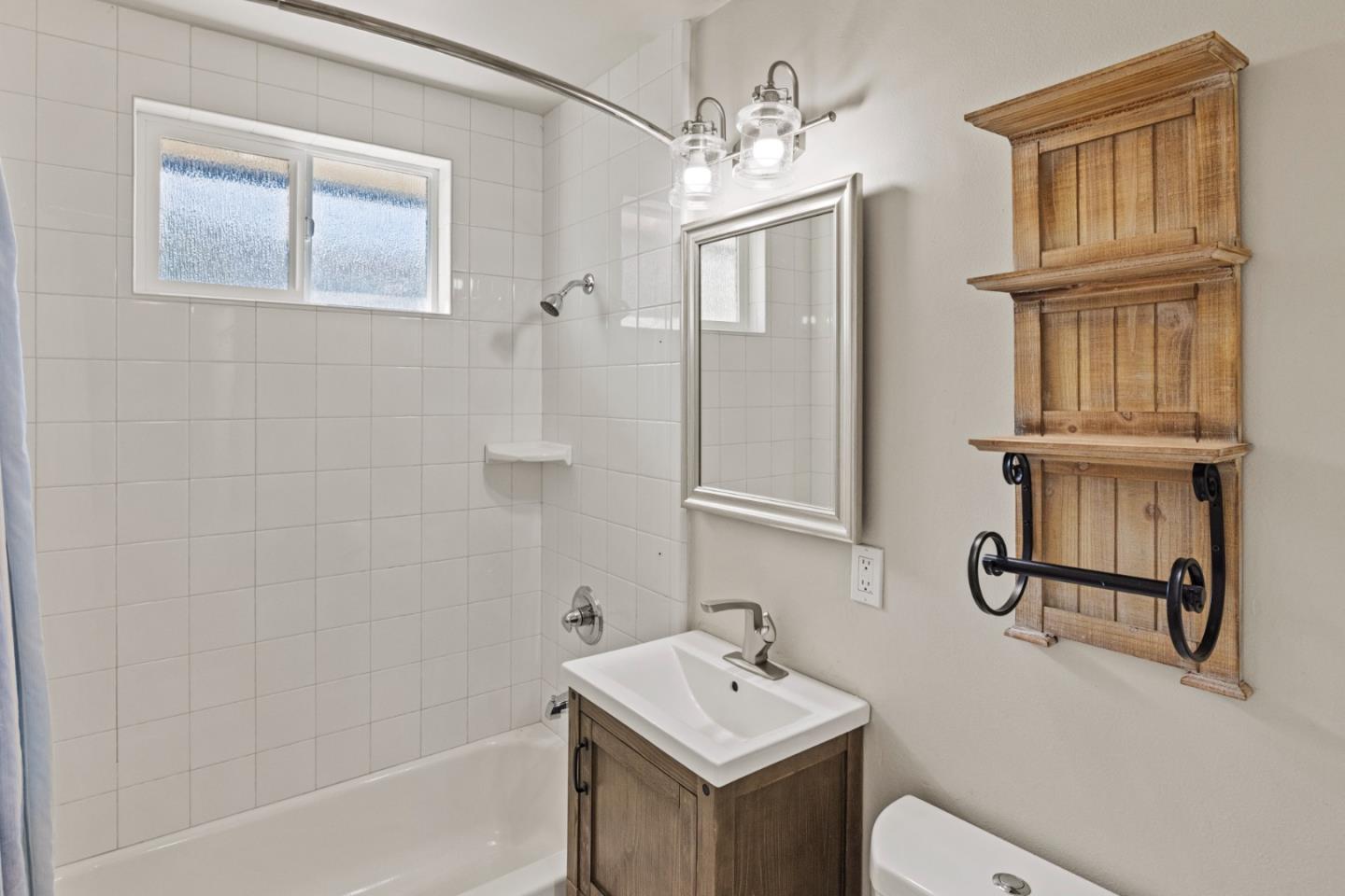 840 Filmore Street Monterey, CA 93940 - Photo 22 of 39 a bathroom with a sink a toilet and shower