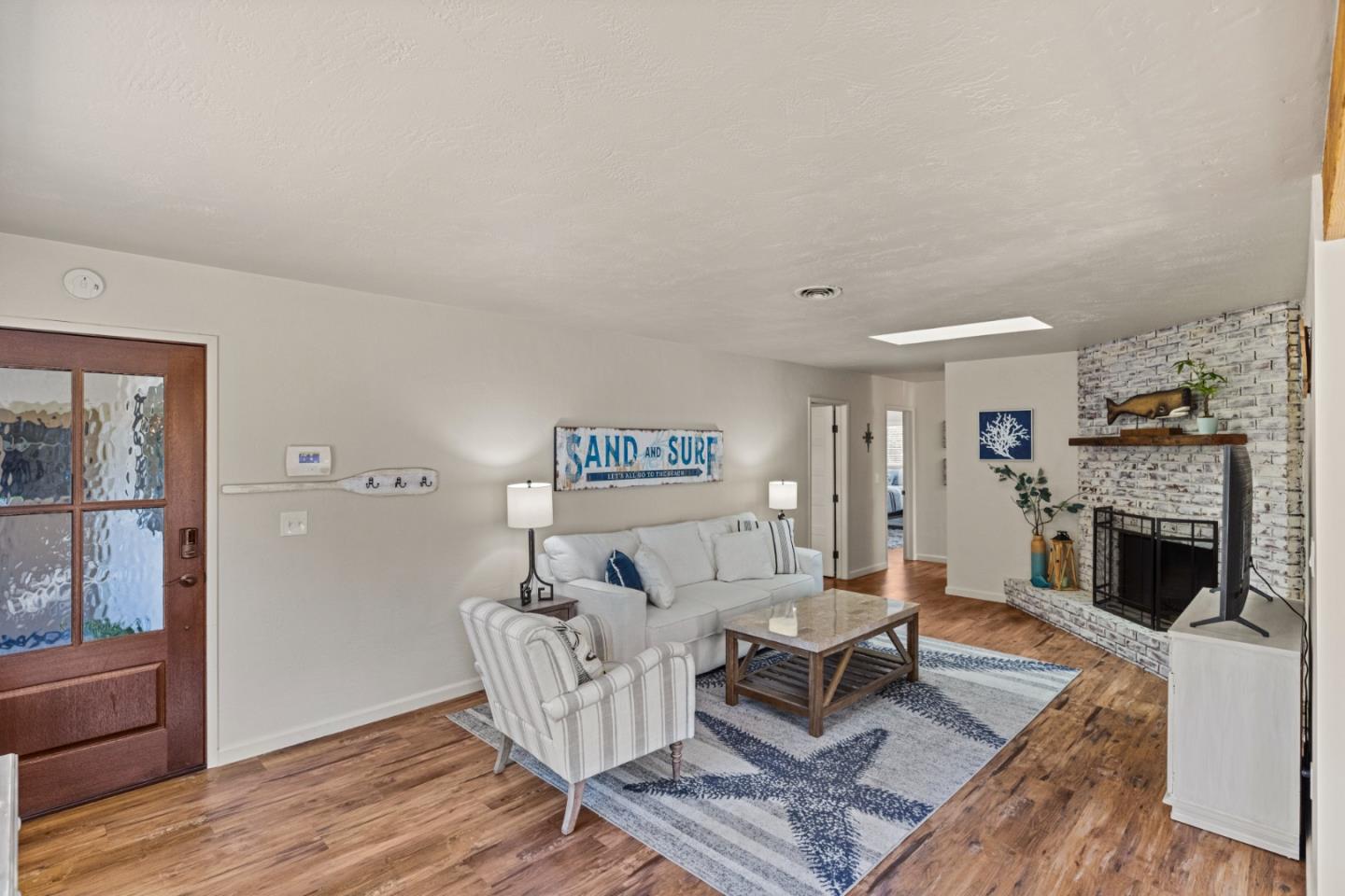 840 Filmore Street Monterey, CA 93940 - Photo 3 of 39 a living room with furniture and a fireplace