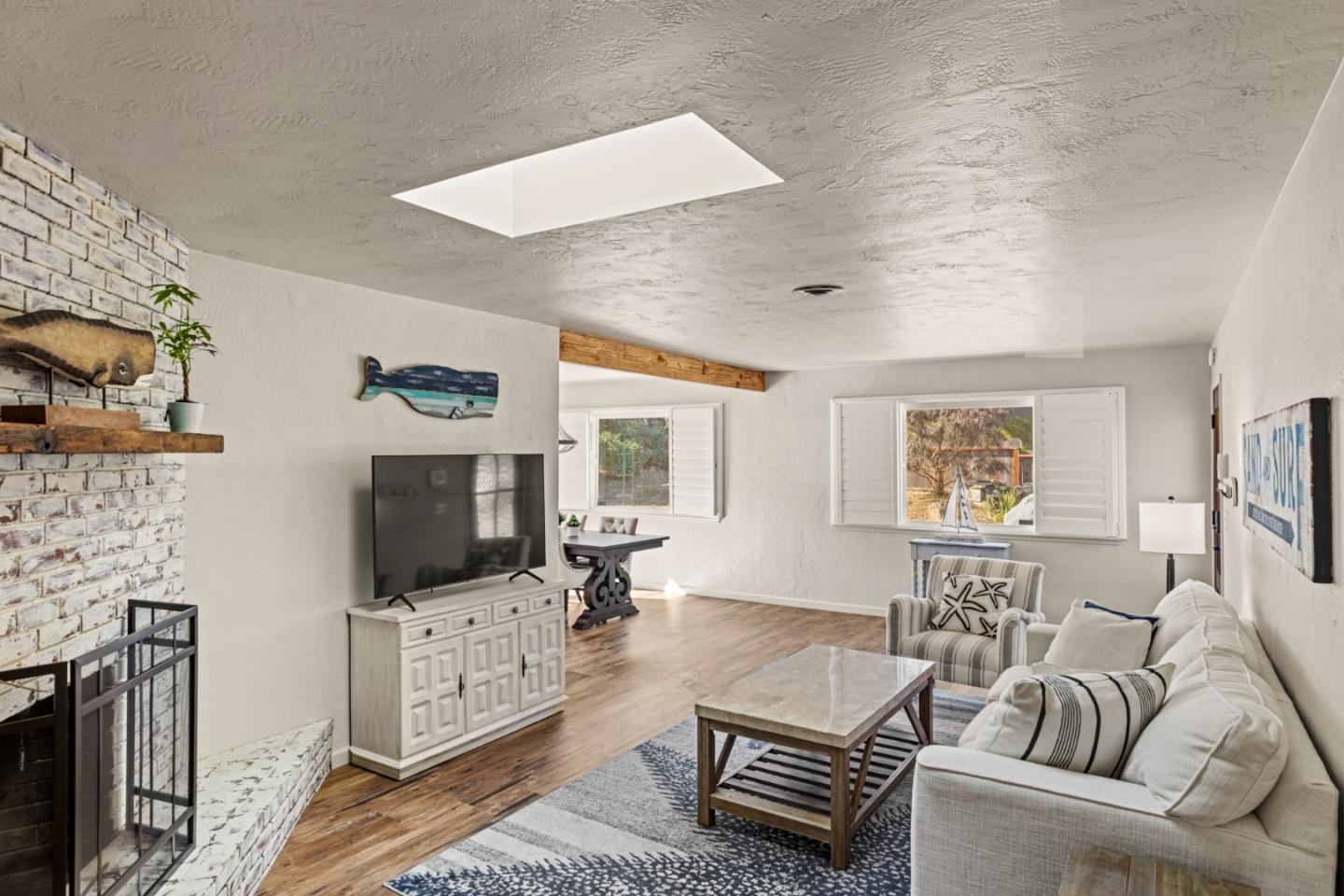 840 Filmore Street Monterey, CA 93940 - Photo 4 of 39 a living room with furniture and a flat screen tv