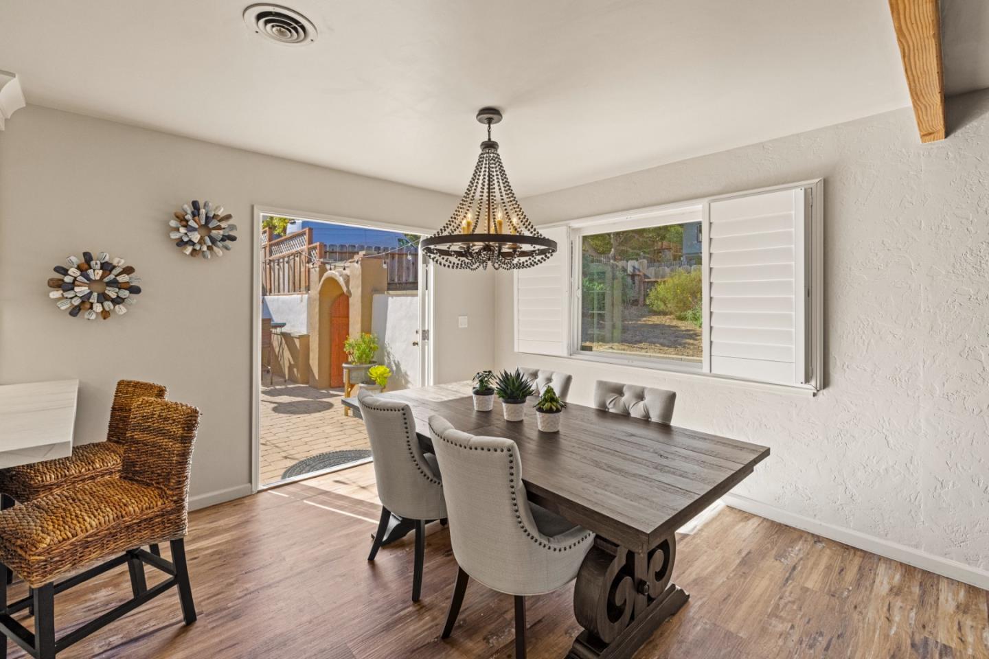 840 Filmore Street Monterey, CA 93940 - Photo 7 of 39 a dining room with furniture a chandelier and wooden floor