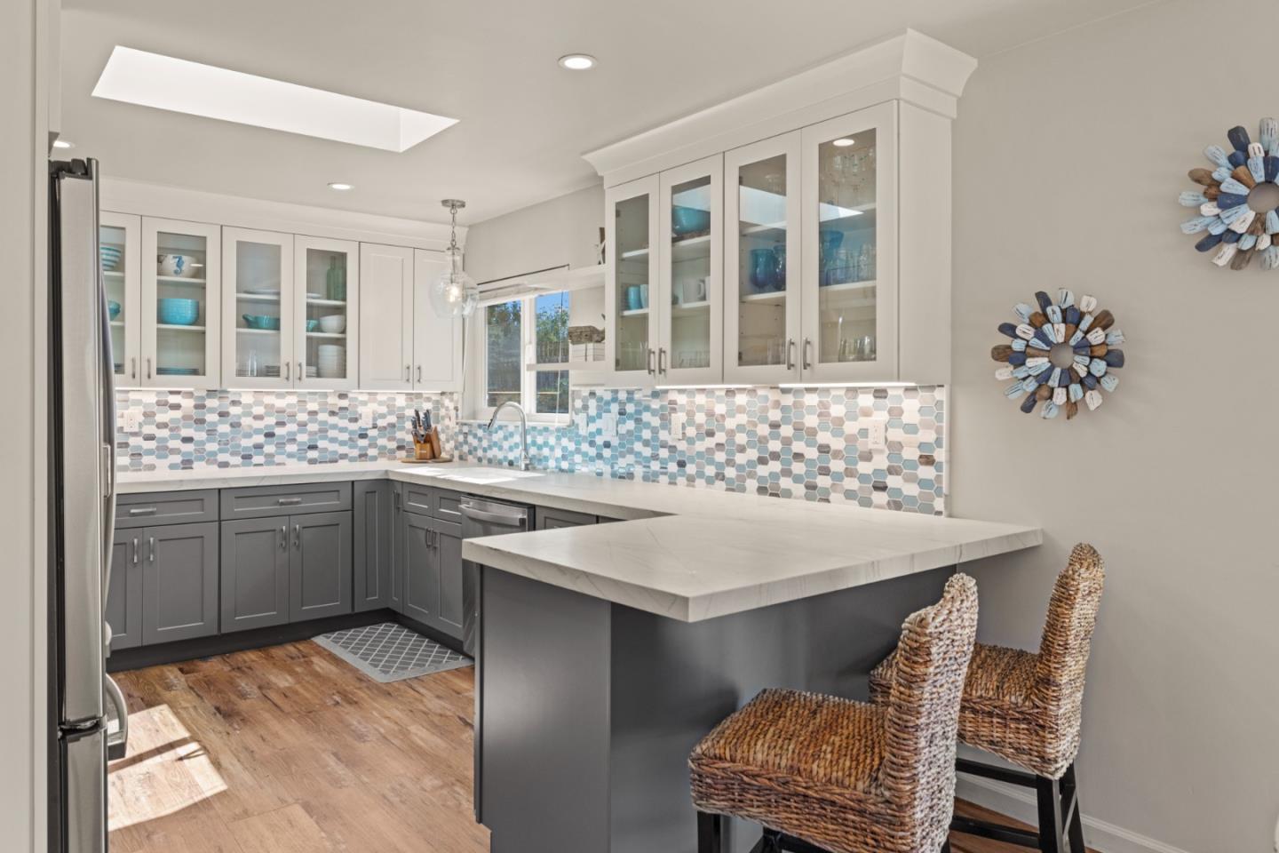 840 Filmore Street Monterey, CA 93940 - Photo 9 of 39 a kitchen with a sink and chairs