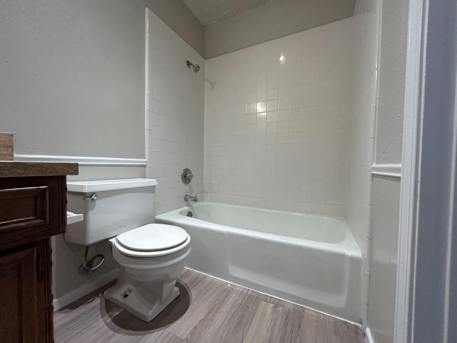 4812 66th Street, Unit B Lubbock, TX 79414 - Photo 7 of 9 a bathroom with a sink and a toilet