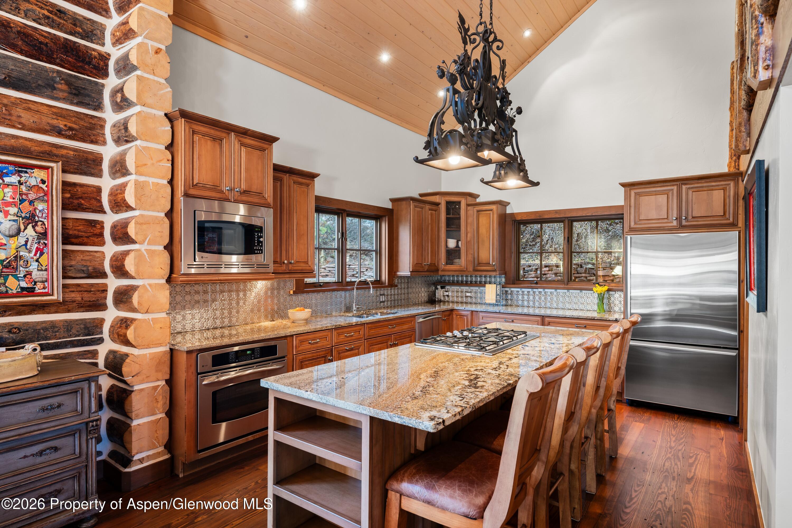 397 Oak Road Basalt, CO 81621 - Photo 12 of 32 a kitchen with stainless steel appliances granite countertop a sink and a stove