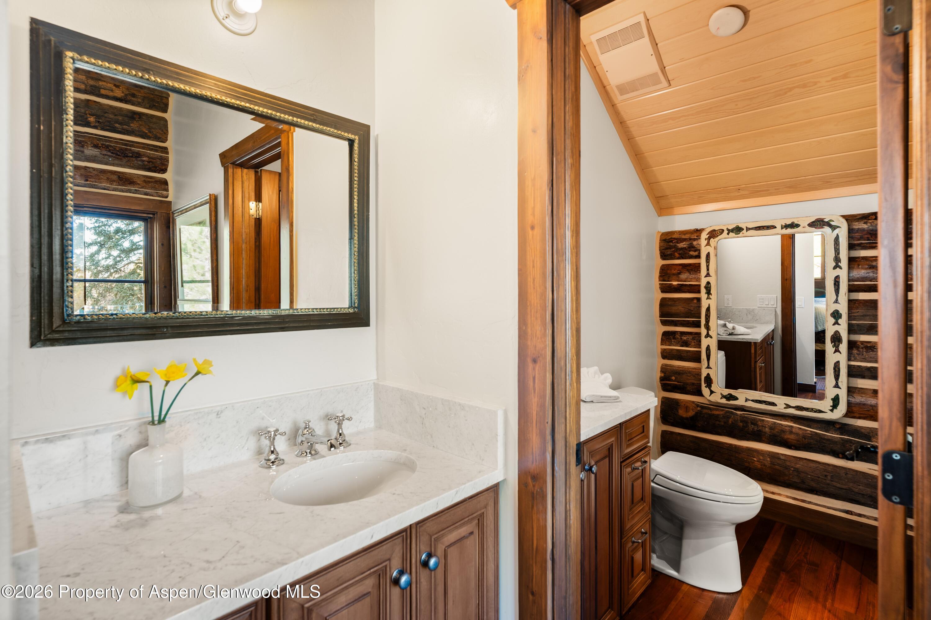 397 Oak Road Basalt, CO 81621 - Photo 15 of 32 a bathroom with a granite countertop sink toilet and shower