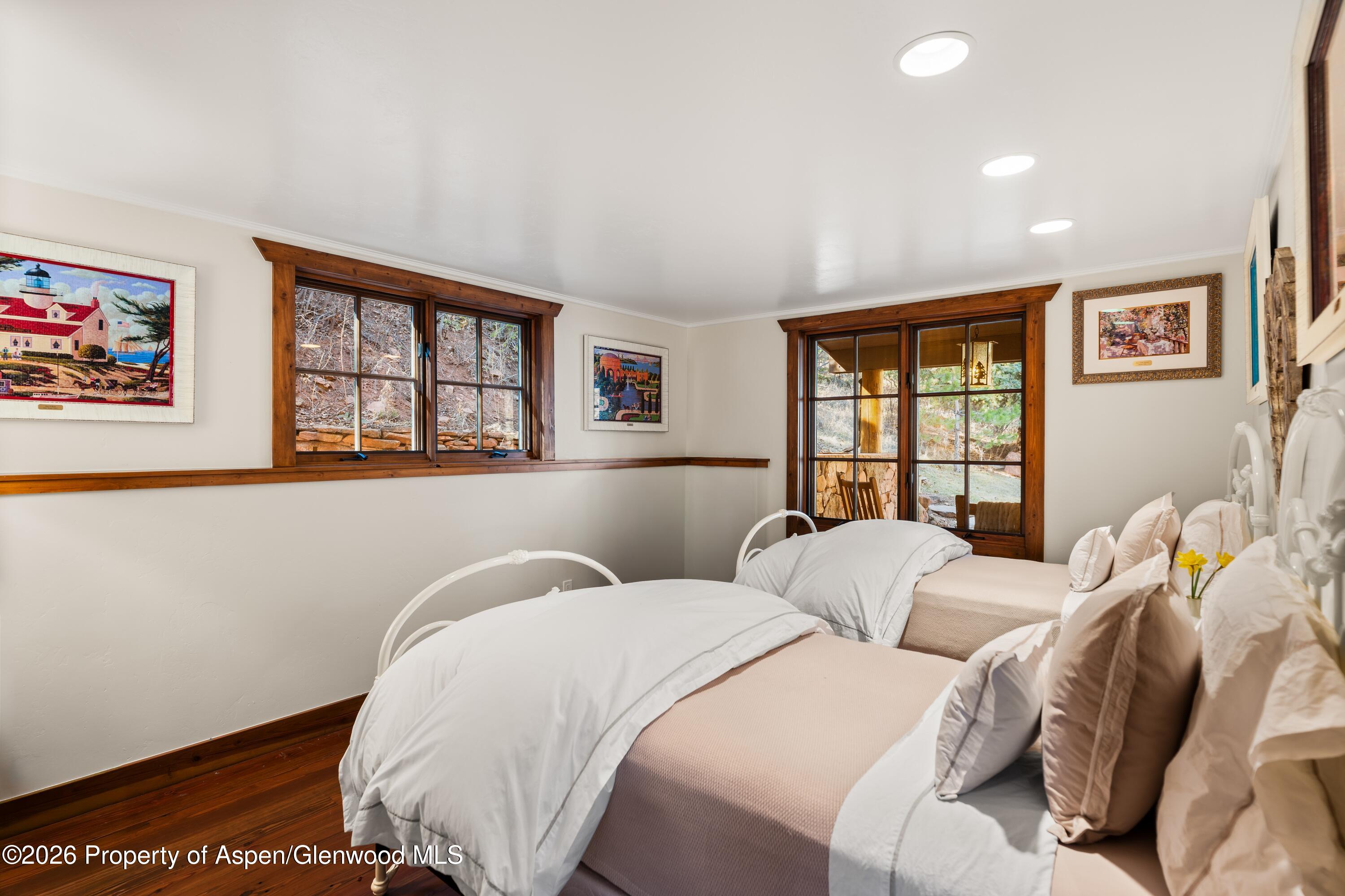 397 Oak Road Basalt, CO 81621 - Photo 19 of 32 a bedroom with two beds and a window