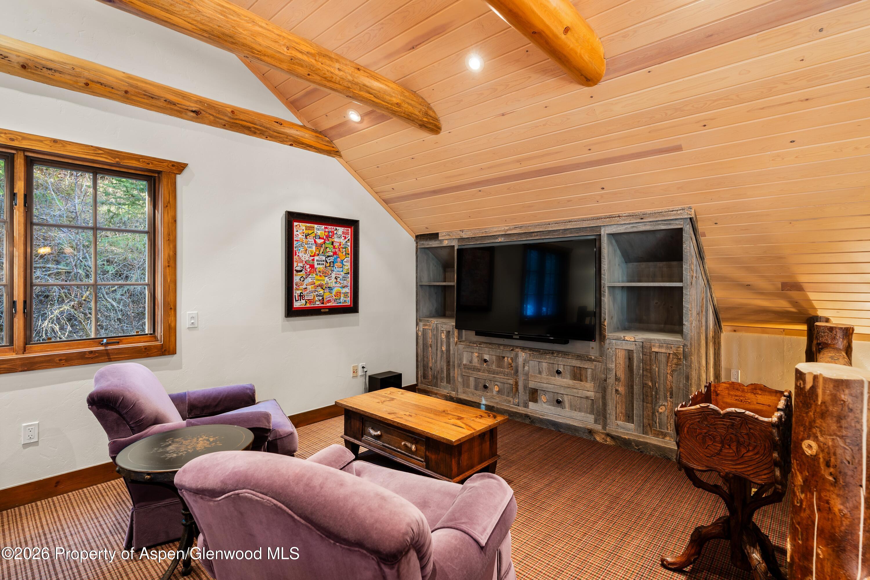 397 Oak Road Basalt, CO 81621 - Photo 21 of 32 a living room with furniture and a flat screen tv