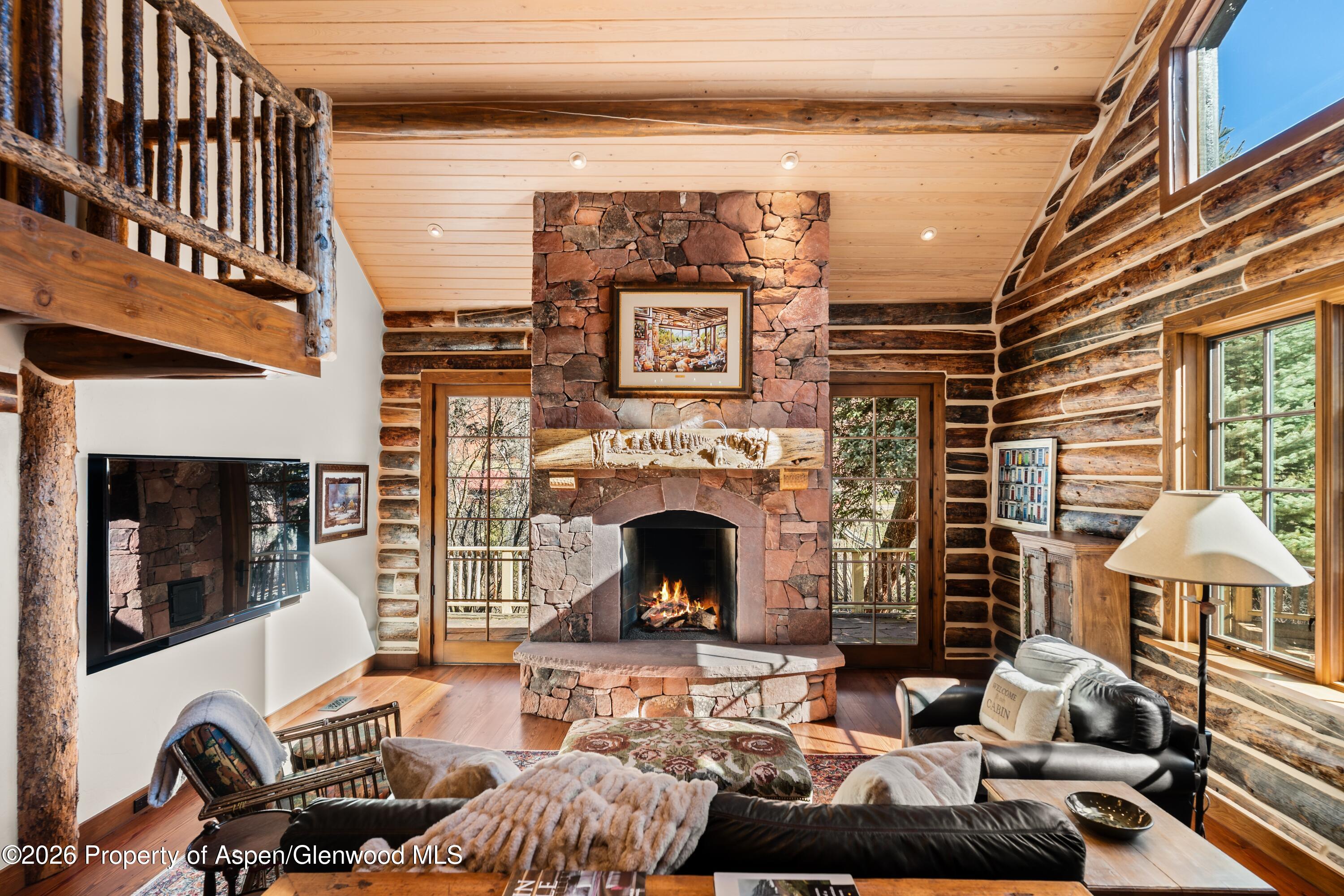 397 Oak Road Basalt, CO 81621 - Photo 4 of 32 a living room with furniture and a fireplace