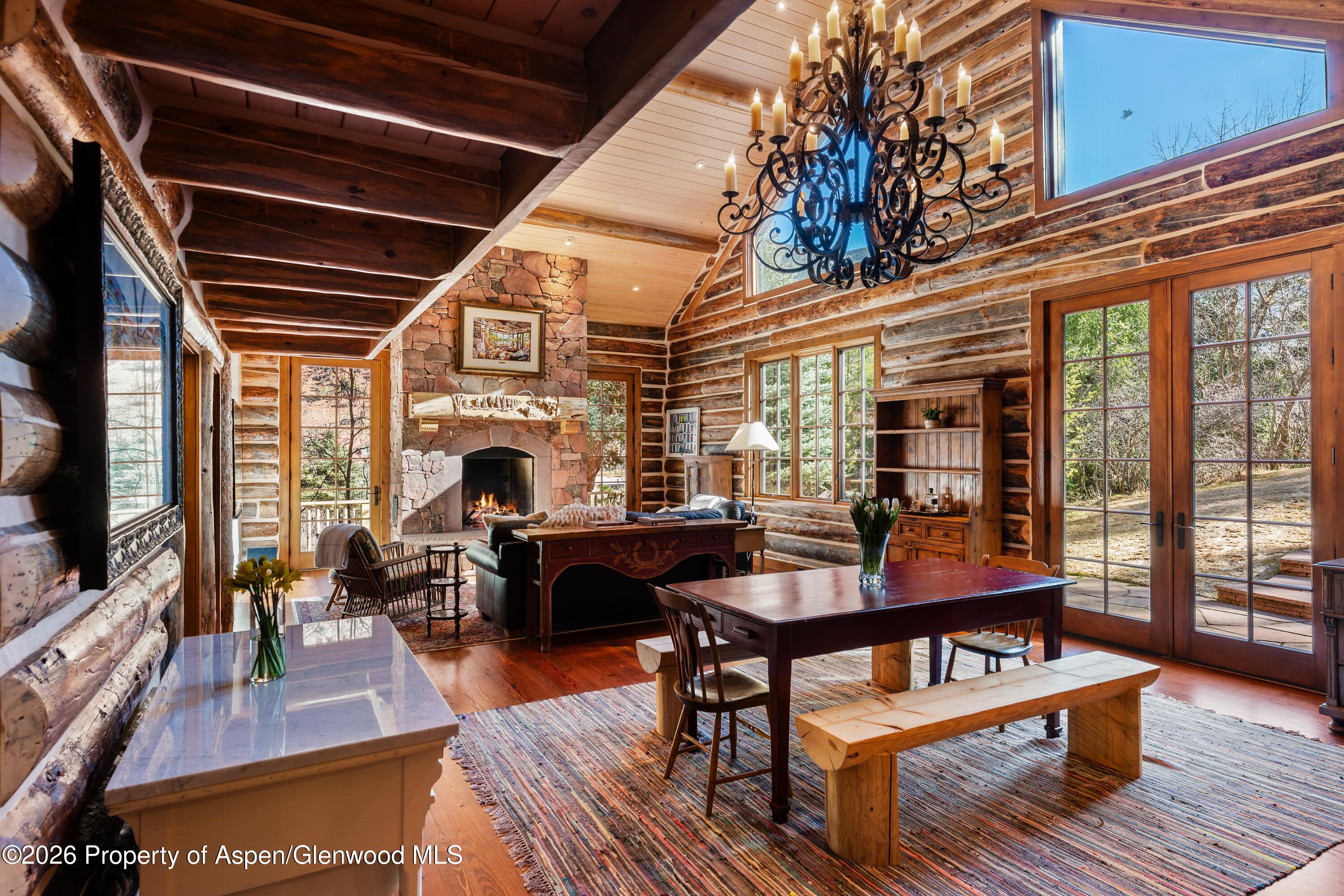 397 Oak Road Basalt, CO 81621 - Photo 8 of 32 a living room with furniture a rug and a flat screen tv