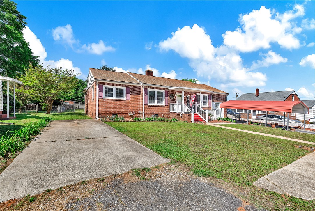 219 Beaty Square Anderson, SC 29624 - Photo 31 of 32 This charming brick home offers a welcoming facade with a well-maintained front yard and convenient carport.