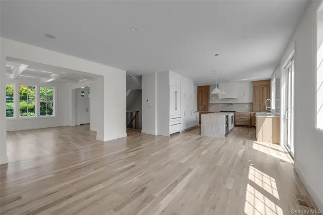a view of a kitchen with a sink and a window