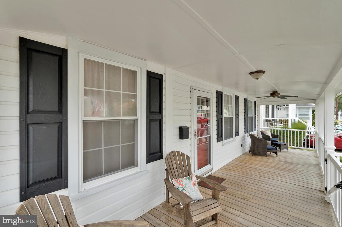 4037 7th Street North Beach, MD 20714 - Photo 17 of 54 a dining room with furniture and wooden floor