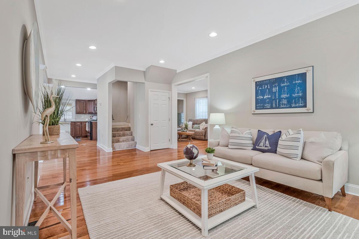 4037 7th Street North Beach, MD 20714 - Photo 2 of 54 a living room with furniture a dining table and kitchen view
