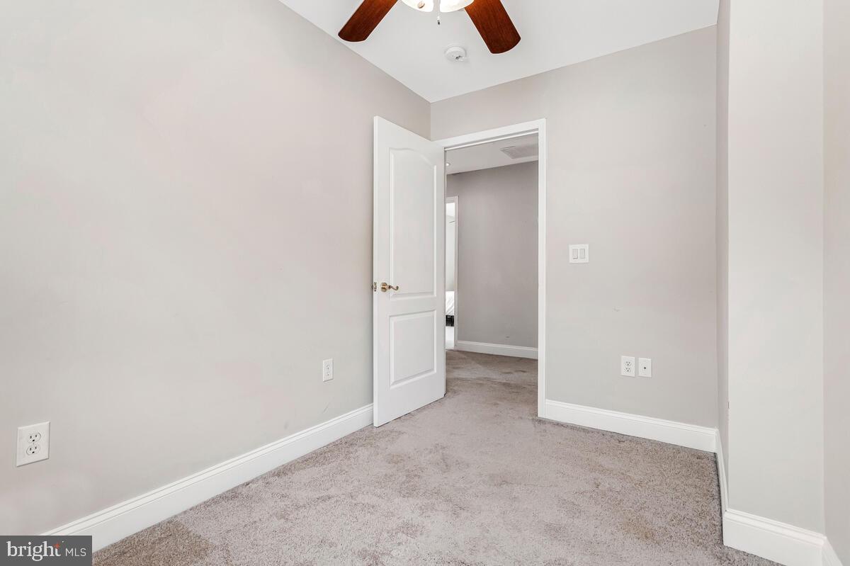 4037 7th Street North Beach, MD 20714 - Photo 40 of 54 wooden floor in an empty room