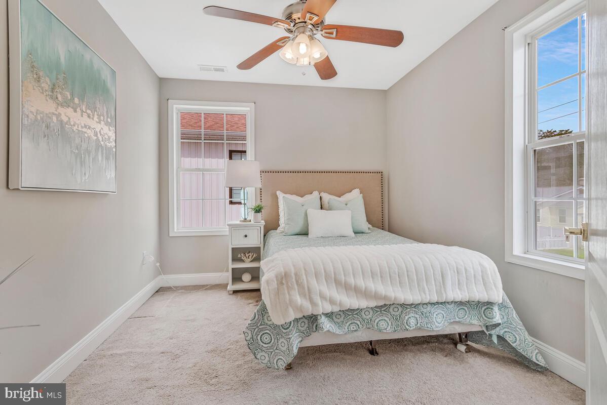 4037 7th Street North Beach, MD 20714 - Photo 41 of 54 a bedroom with a bed and window