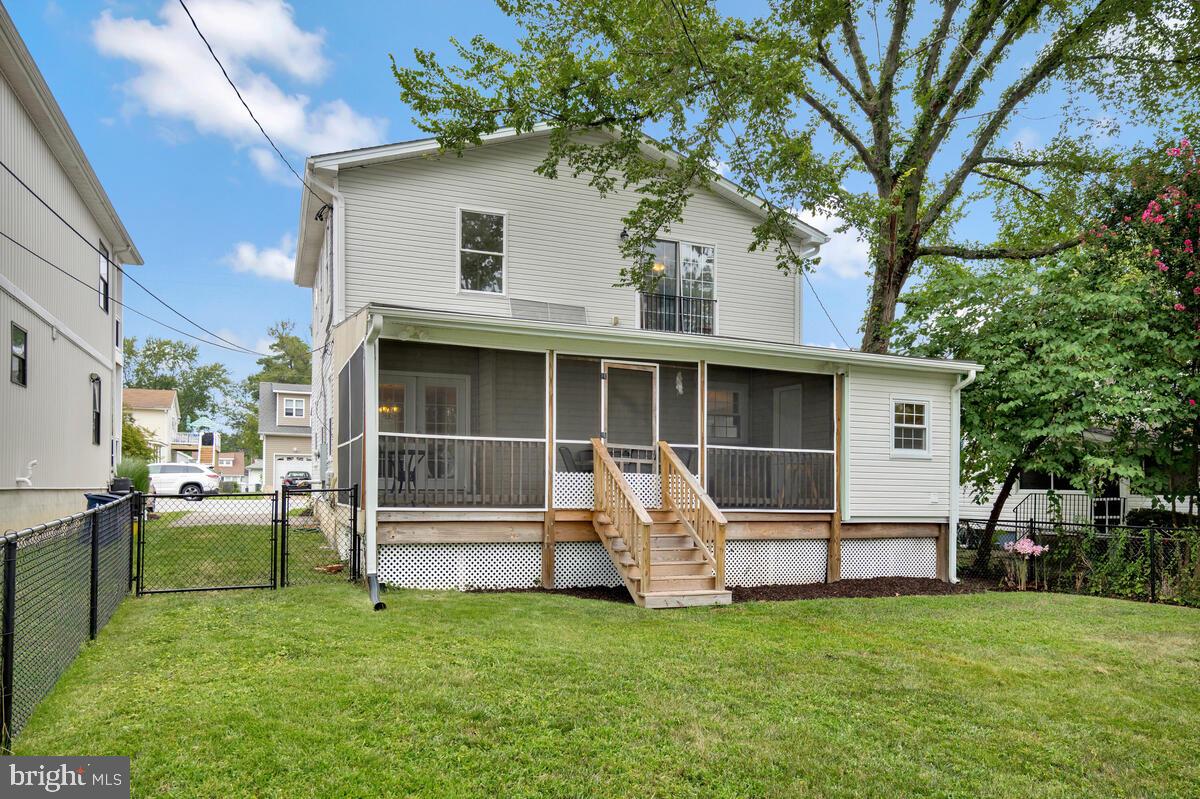 4037 7th Street North Beach, MD 20714 - Photo 44 of 54 a view of a house with a yard