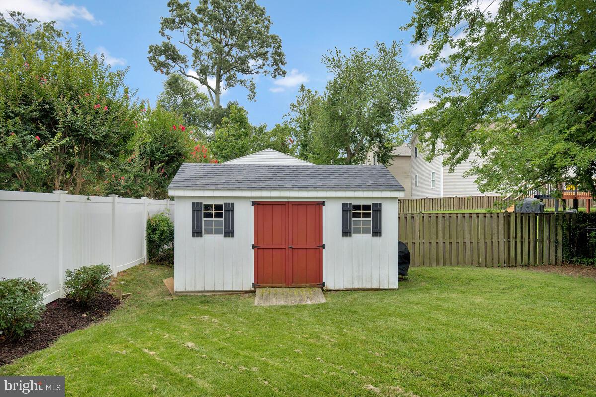 4037 7th Street North Beach, MD 20714 - Photo 53 of 54 a front view of a house with a garden