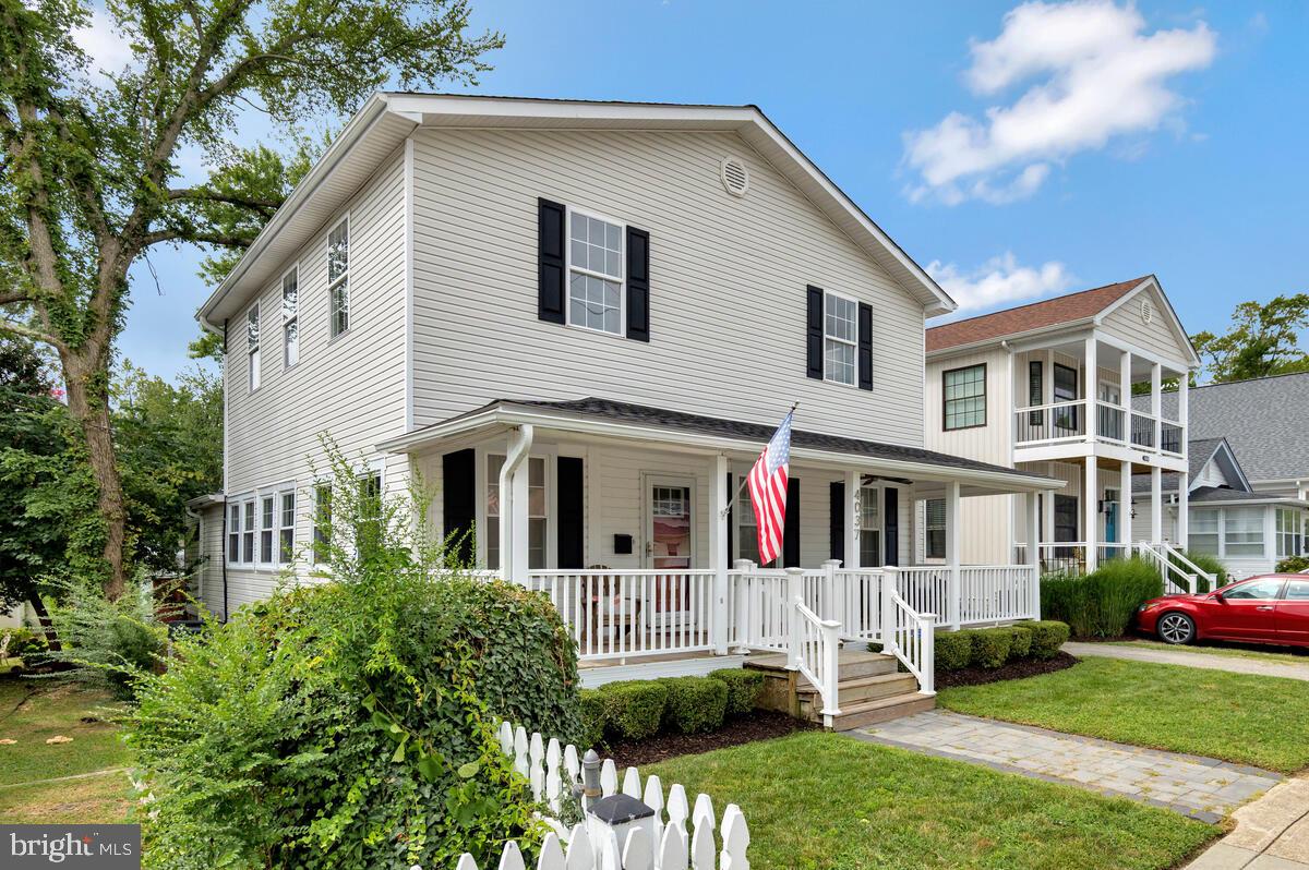 4037 7th Street North Beach, MD 20714 - Photo 8 of 54 a front view of a house with a yard