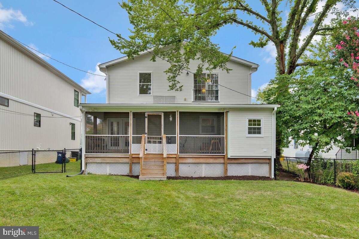 4037 7th Street North Beach, MD 20714 - Photo 9 of 54 a view of a house with backyard and a tree