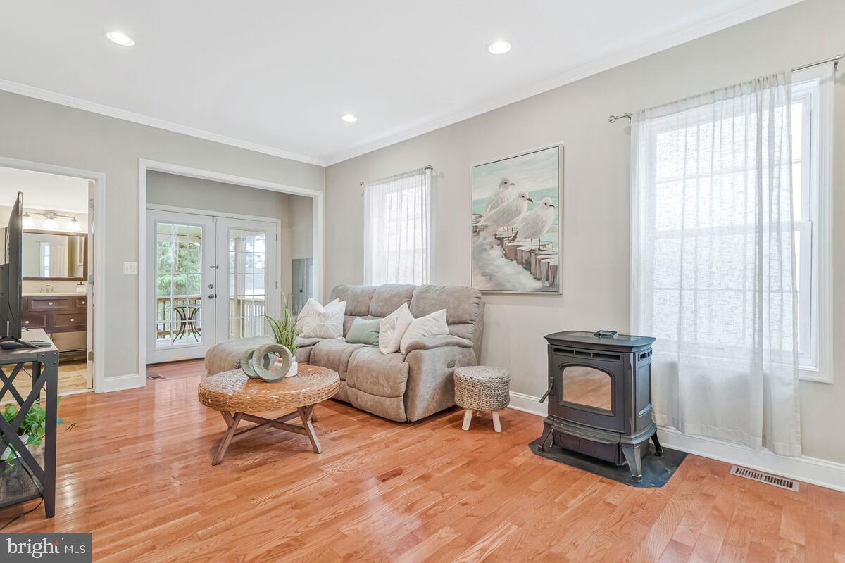 4037 7th Street North Beach, MD 20714 - Photo 10 of 54 a living room with furniture a rug and a window