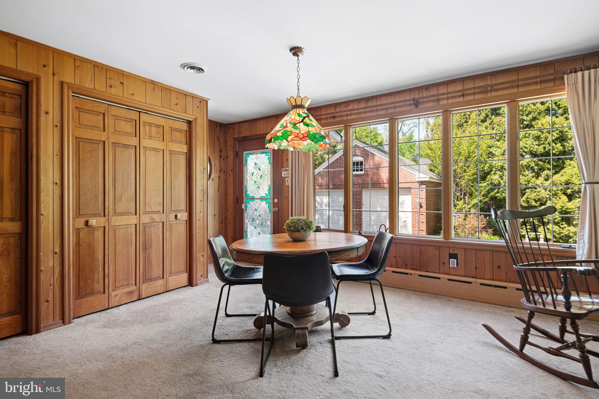 223 Hopkins Road Haddonfield, NJ 08033 - Photo 16 of 51 a dining room with furniture mountain view and a chandelier