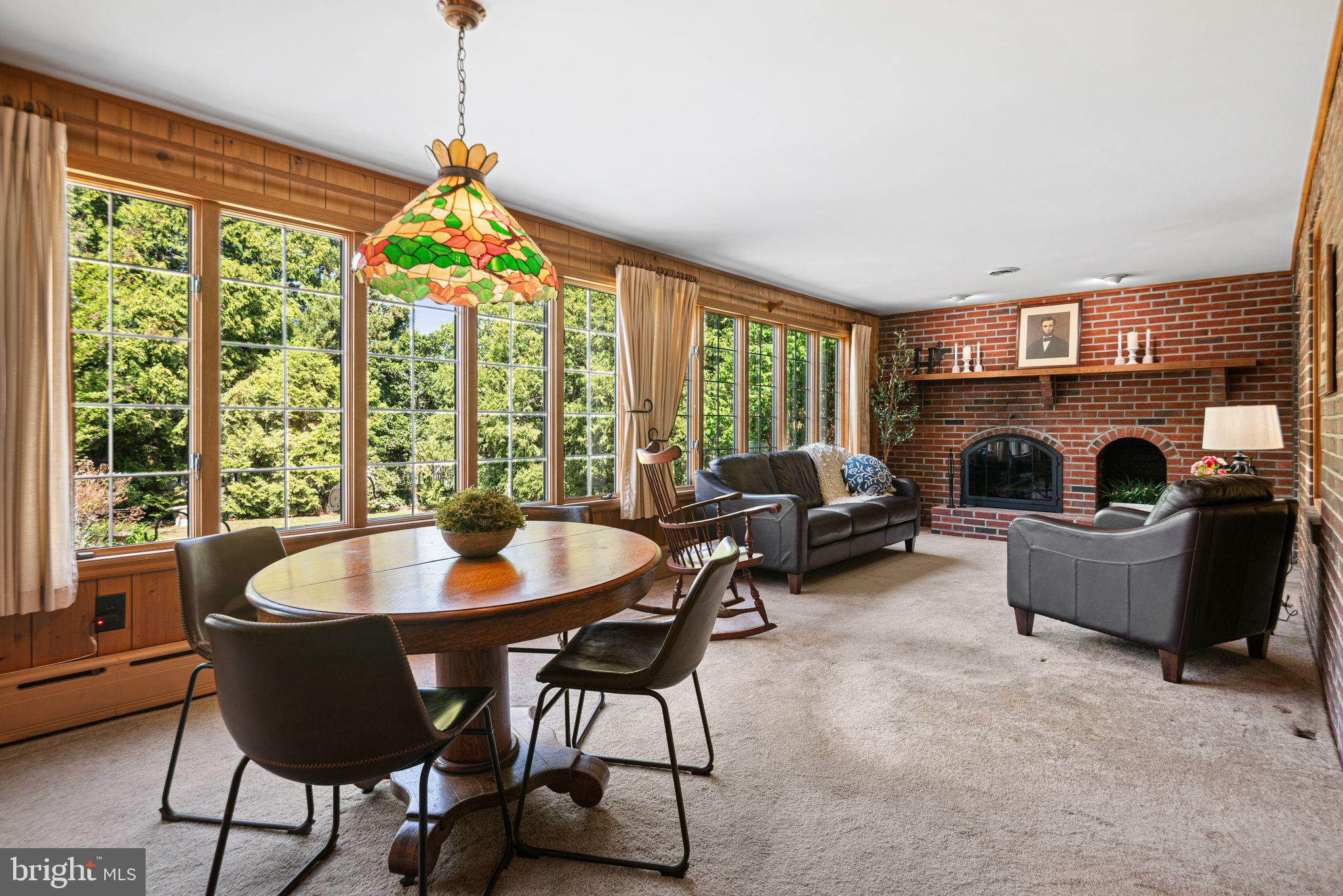 223 Hopkins Road Haddonfield, NJ 08033 - Photo 18 of 51 a living room with furniture and a chandelier