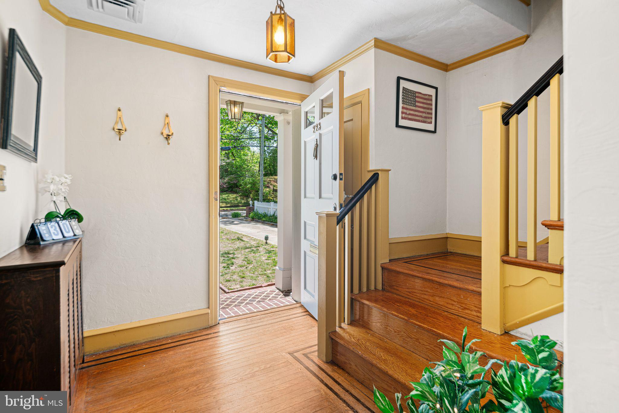 223 Hopkins Road Haddonfield, NJ 08033 - Photo 2 of 51 a view of a hallway with wooden floor and front door