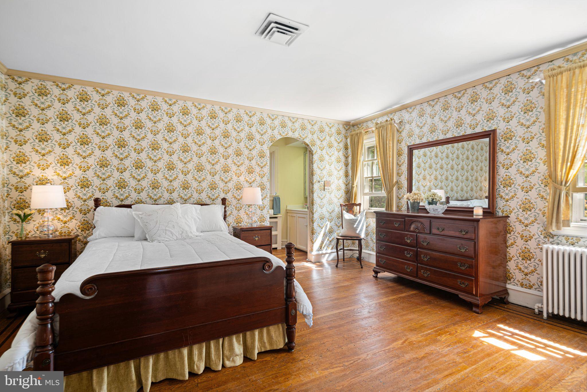 223 Hopkins Road Haddonfield, NJ 08033 - Photo 23 of 51 a bedroom with a bed and wooden floor