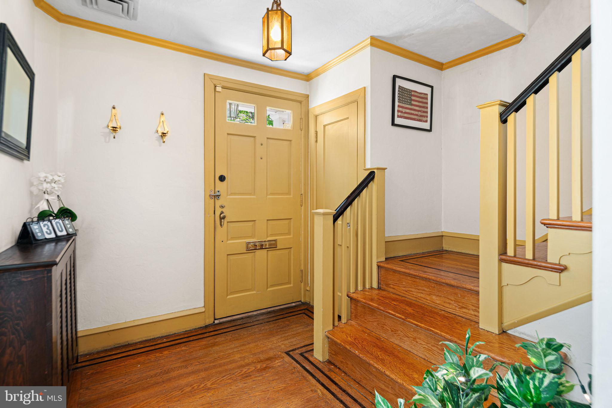 223 Hopkins Road Haddonfield, NJ 08033 - Photo 3 of 51 a view of a hallway with wooden floor and staircase