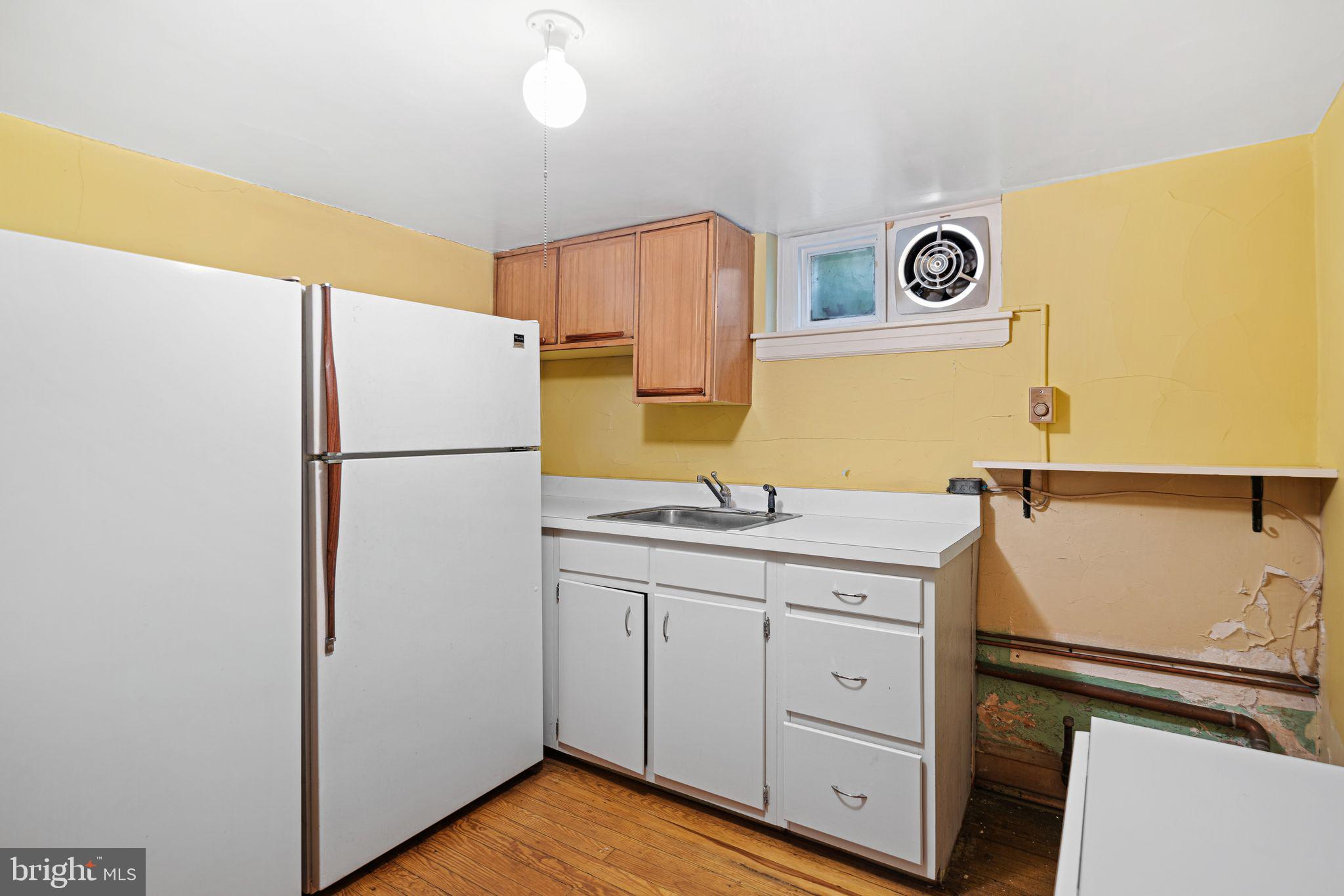 223 Hopkins Road Haddonfield, NJ 08033 - Photo 42 of 51 a kitchen with a refrigerator and a sink