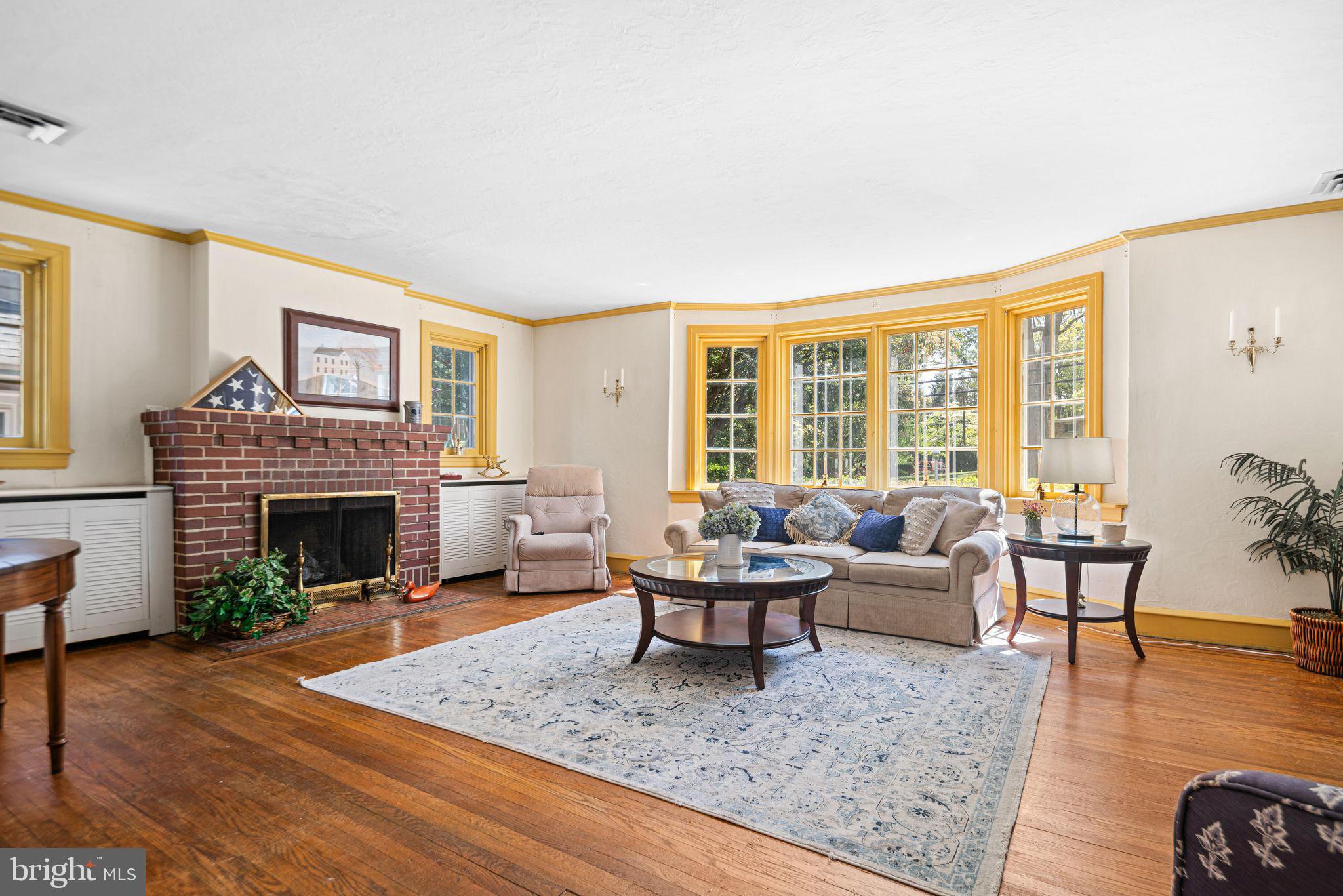 223 Hopkins Road Haddonfield, NJ 08033 - Photo 7 of 51 a living room with furniture and a fireplace