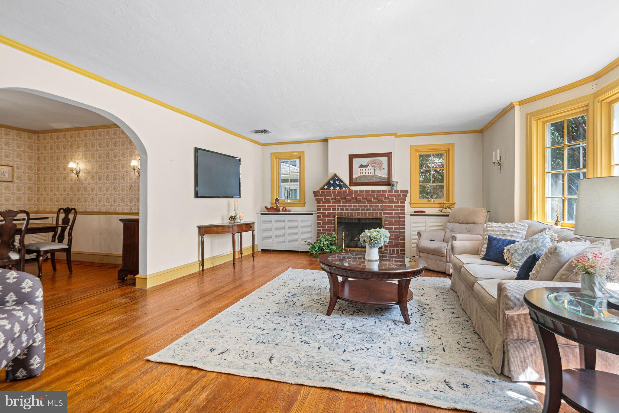 223 Hopkins Road Haddonfield, NJ 08033 - Photo 8 of 51 a living room with furniture and a fireplace
