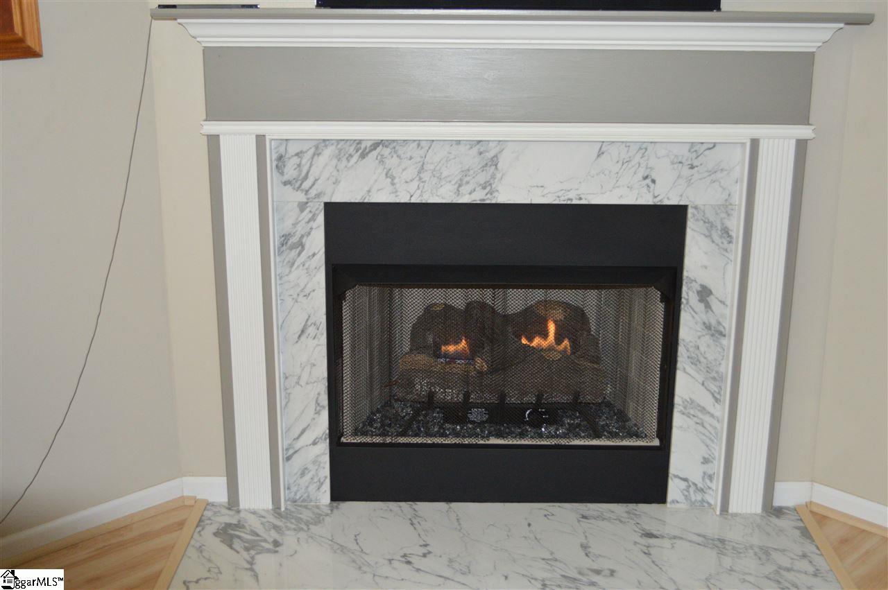 512 East Victor Hill Road Duncan, SC 29334 - Photo 8 of 27 Gas Marble fire place with glass rocks