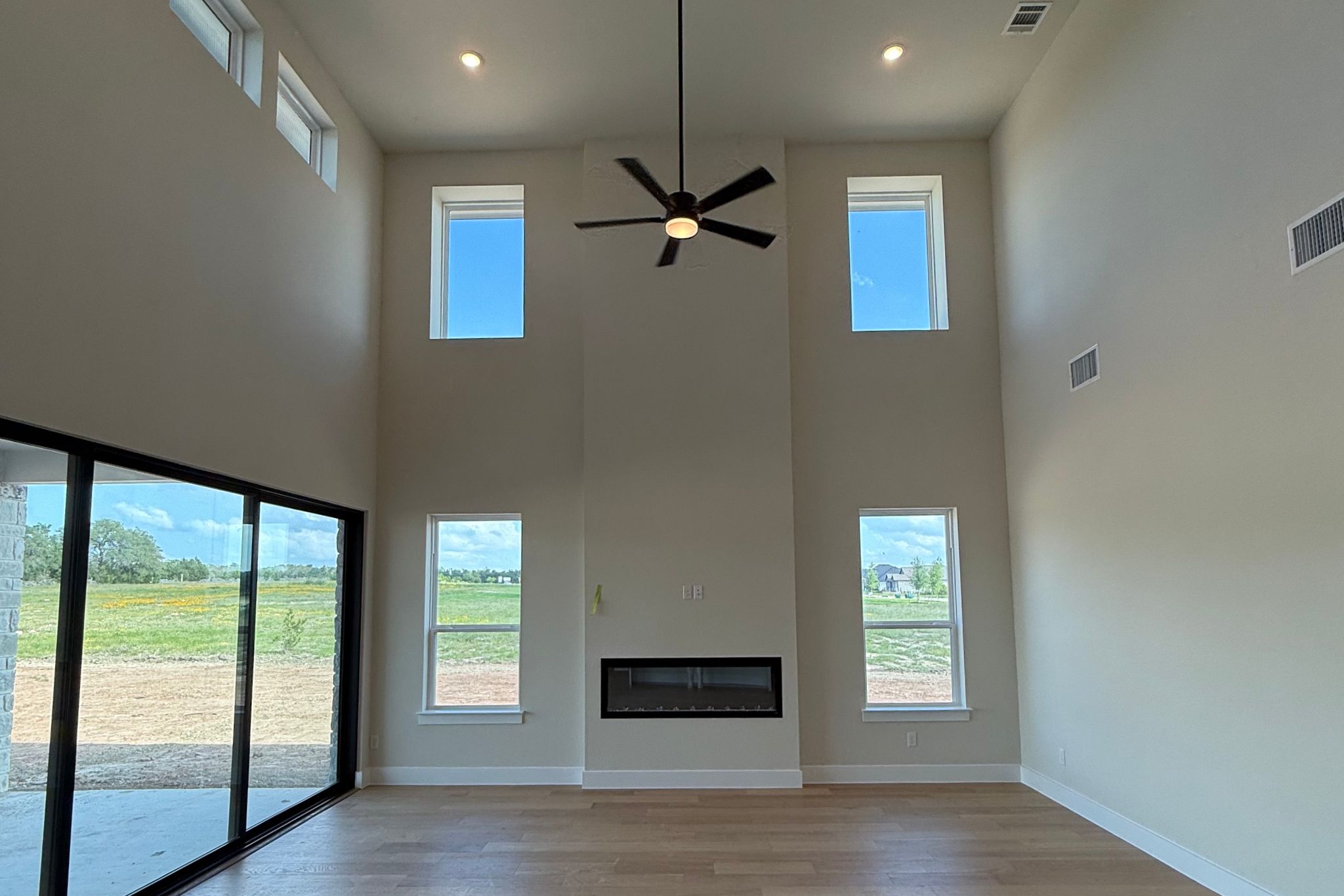 1412 Paxton Lane Georgetown, TX 78633 - Photo 5 of 14 a view of empty room with wooden floor and fan