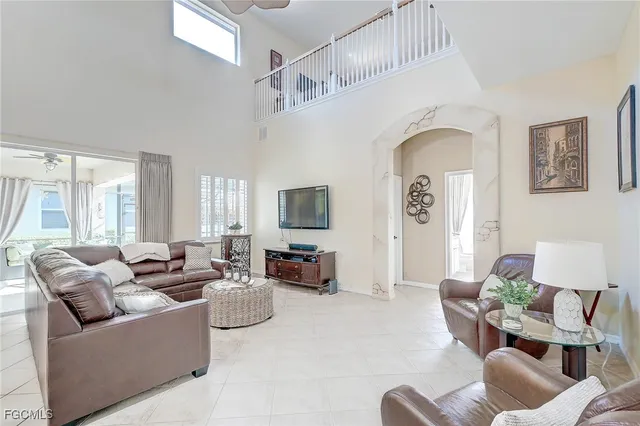 a living room with furniture or couch and a large window