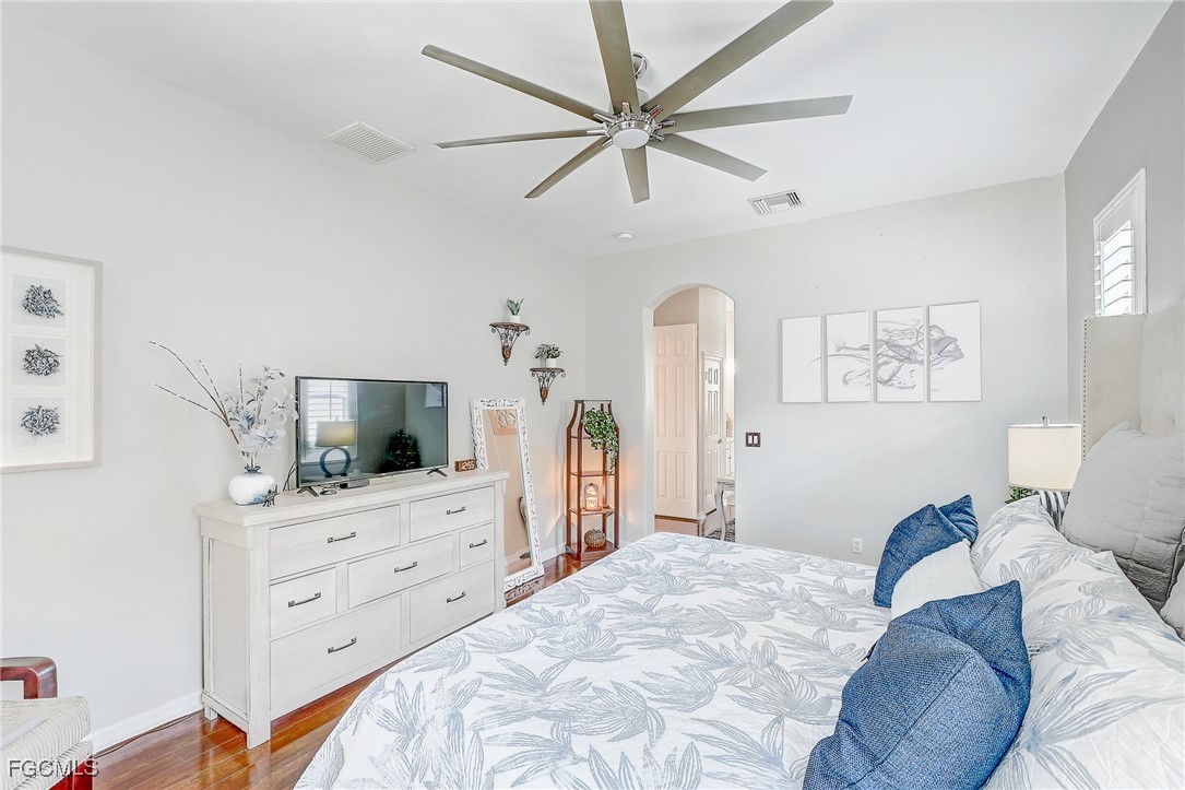 12890 Timber Ridge Drive Fort Myers, FL 33913 - Photo 20 of 39 a bedroom with furniture and a flat screen tv