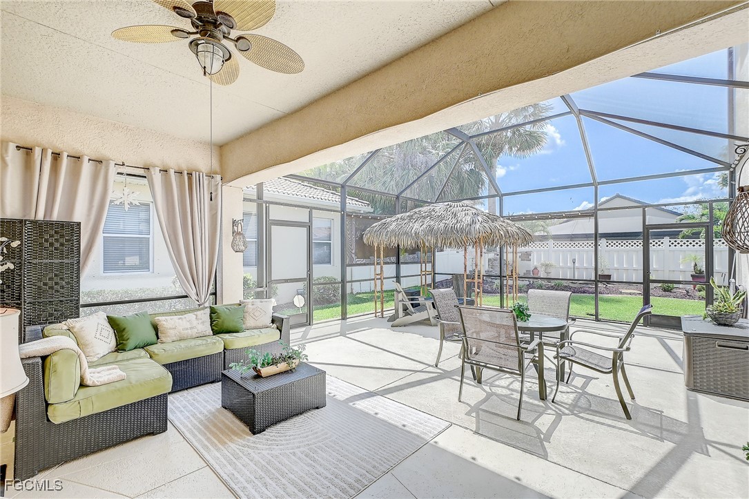 12890 Timber Ridge Drive Fort Myers, FL 33913 - Photo 28 of 39 a outdoor space with patio couch and glass door