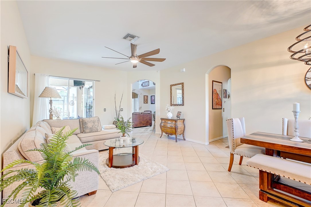 12890 Timber Ridge Drive Fort Myers, FL 33913 - Photo 4 of 39 a living room with furniture and wooden floor
