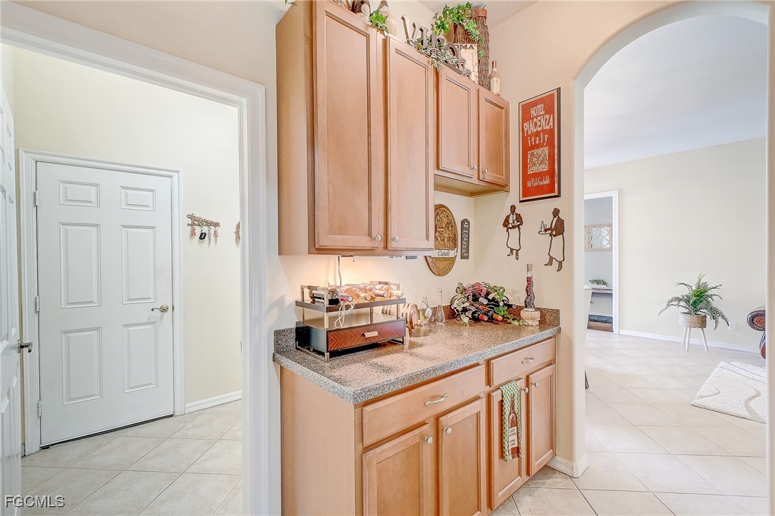12890 Timber Ridge Drive Fort Myers, FL 33913 - Photo 9 of 39 a kitchen with stainless steel appliances a sink and cabinets
