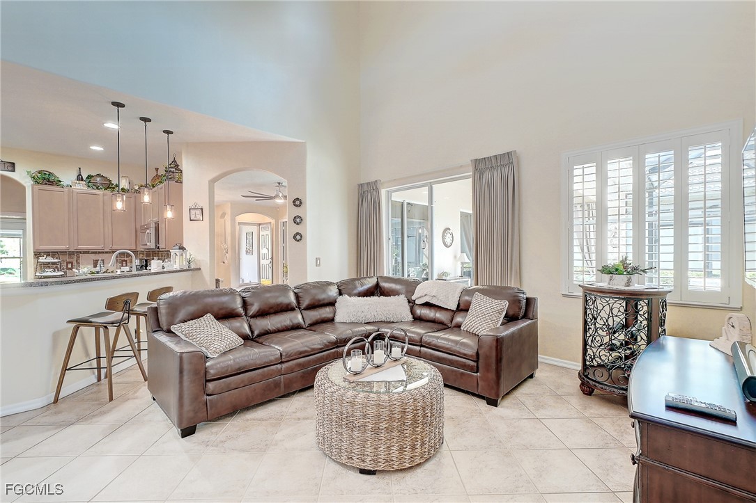 12890 Timber Ridge Drive Fort Myers, FL 33913 - Photo 10 of 39 a living room with furniture and a large window