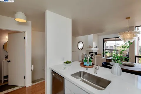 a kitchen with a sink and a refrigerator