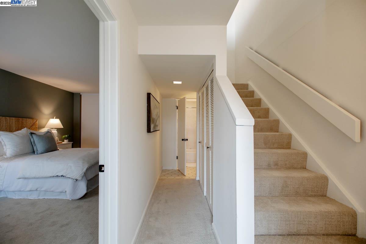 2101 Shore Line Drive, Unit 475 Alameda, CA 94501 - Photo 34 of 37 a view of a bedroom with a bed and lamp