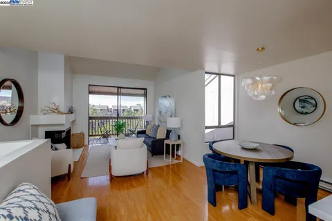 a living room with furniture a window and a table