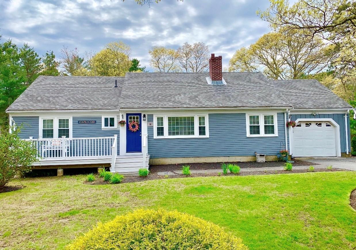 57 Anchor Lane Cotuit, MA 02635 - Photo 1 of 29 a front view of a house with a yard