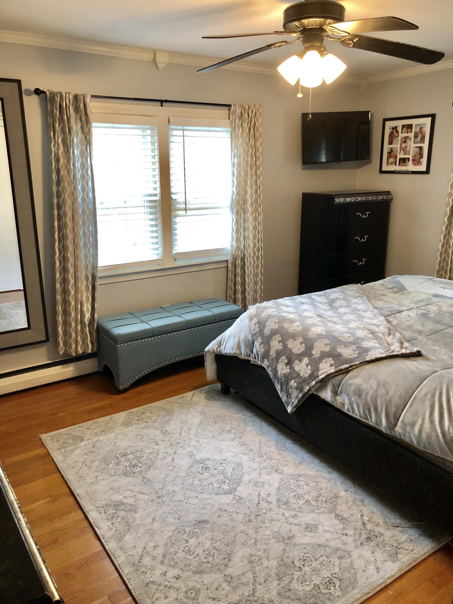 57 Anchor Lane Cotuit, MA 02635 - Photo 13 of 29 a bedroom with a bed and a dresser