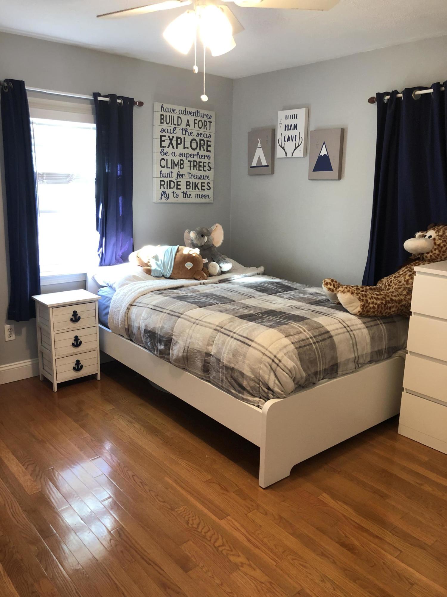 57 Anchor Lane Cotuit, MA 02635 - Photo 17 of 29 a bedroom with a bed and a window