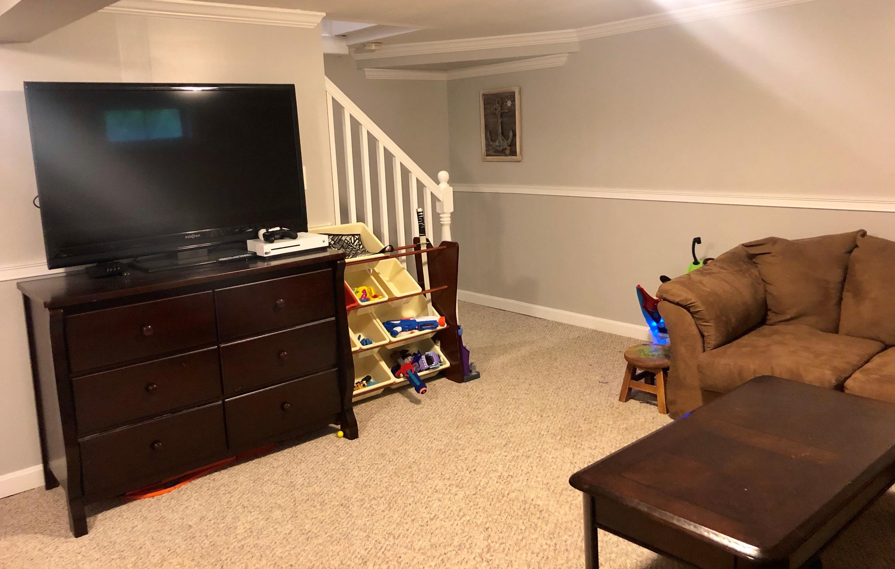 57 Anchor Lane Cotuit, MA 02635 - Photo 20 of 29 a living room with furniture and a flat screen tv