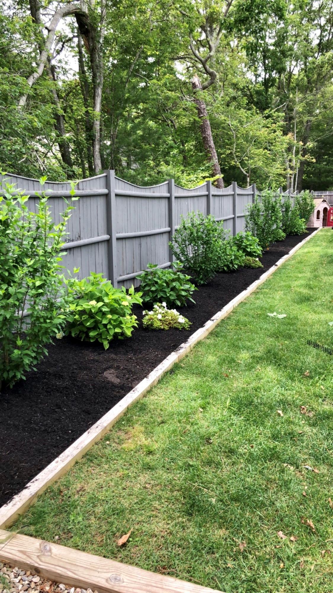 57 Anchor Lane Cotuit, MA 02635 - Photo 24 of 29 a view of backyard with potted plants and a large tree