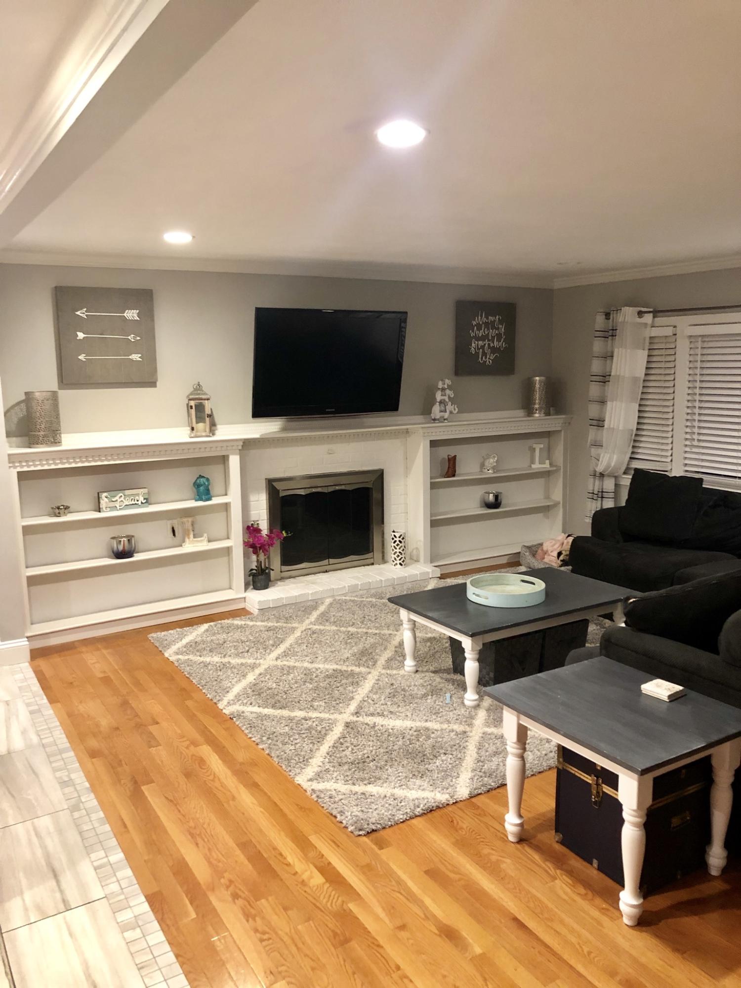 57 Anchor Lane Cotuit, MA 02635 - Photo 8 of 29 a living room with furniture and a fireplace