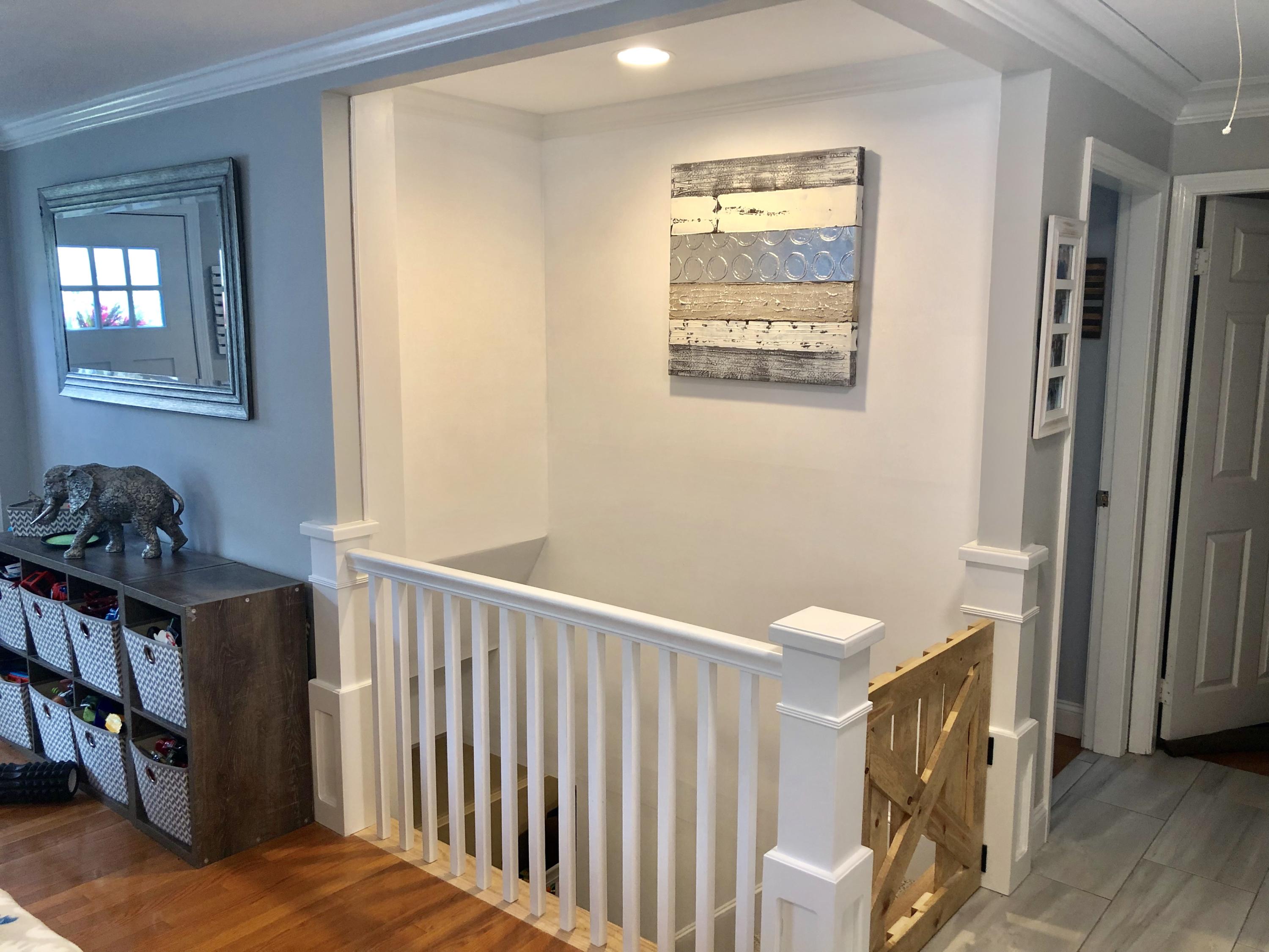 57 Anchor Lane Cotuit, MA 02635 - Photo 10 of 29 a view of a hallway to a livingroom with furniture and stairs