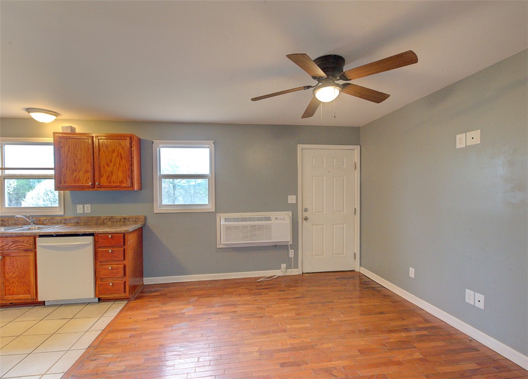 325 Rock Quarry Road Travelers Rest, SC 29690 - Photo 5 of 37 This inviting kitchen and living area features a bright and open atmosphere.